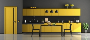 Black and yellow modern kitchen with dining table and chairs - 3d rendering
